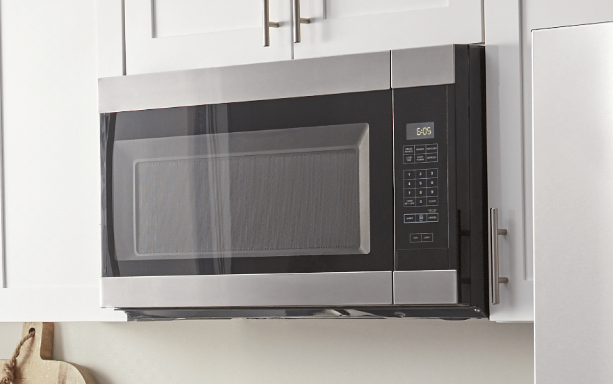 Amana® built-in microwave installed in white cabinetry