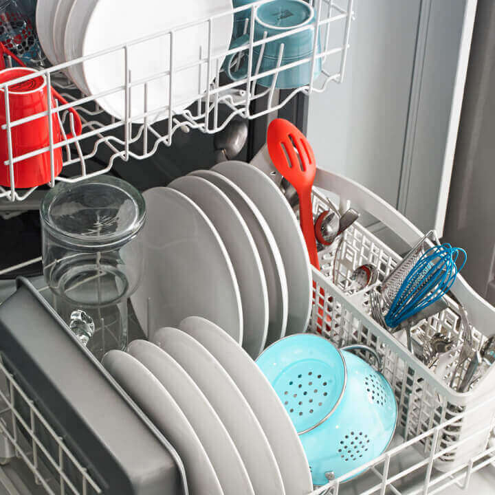 Amana® dishwasher loaded with dishes
