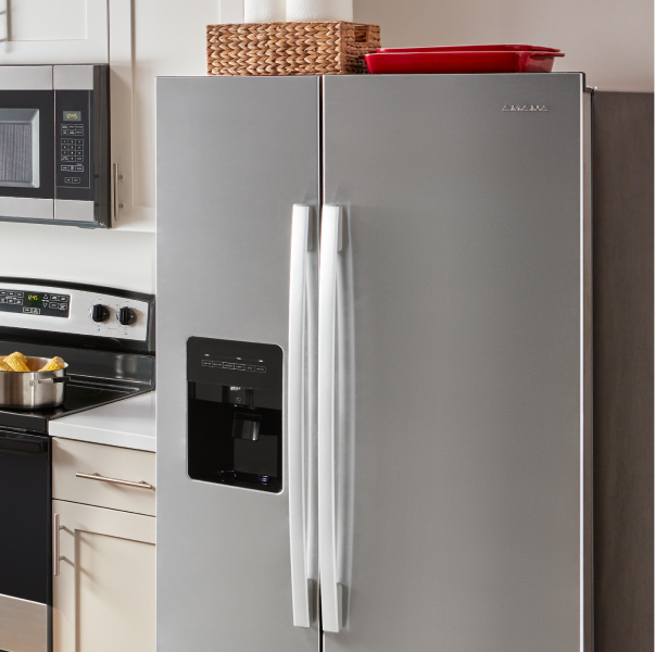 An Amana® refrigerator in a kitchen.