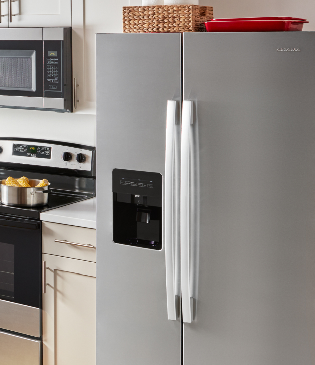 An Amana® refrigerator in a kitchen.