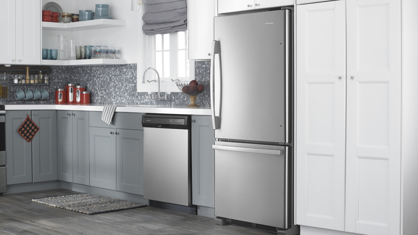 Amana® appliances set in white and grey cabinetry
