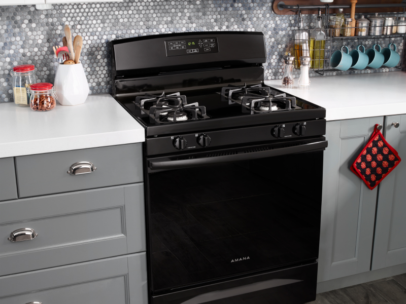 Black Amana® range set in black cabinetry
