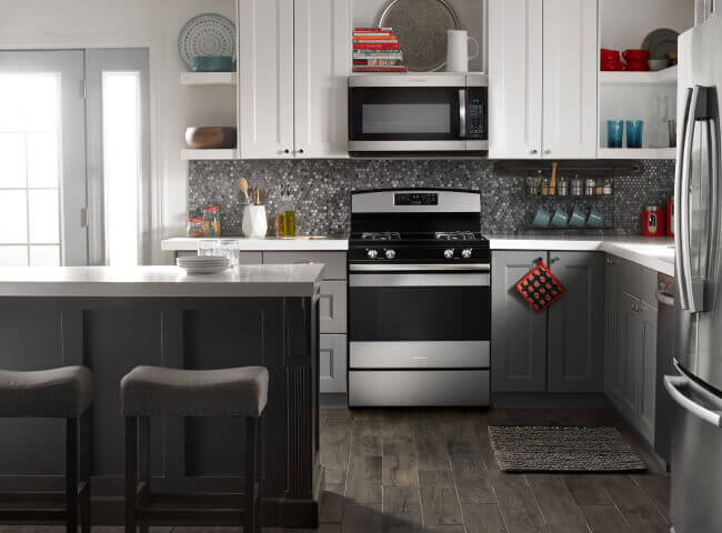 Amana® range and microwave in kitchen