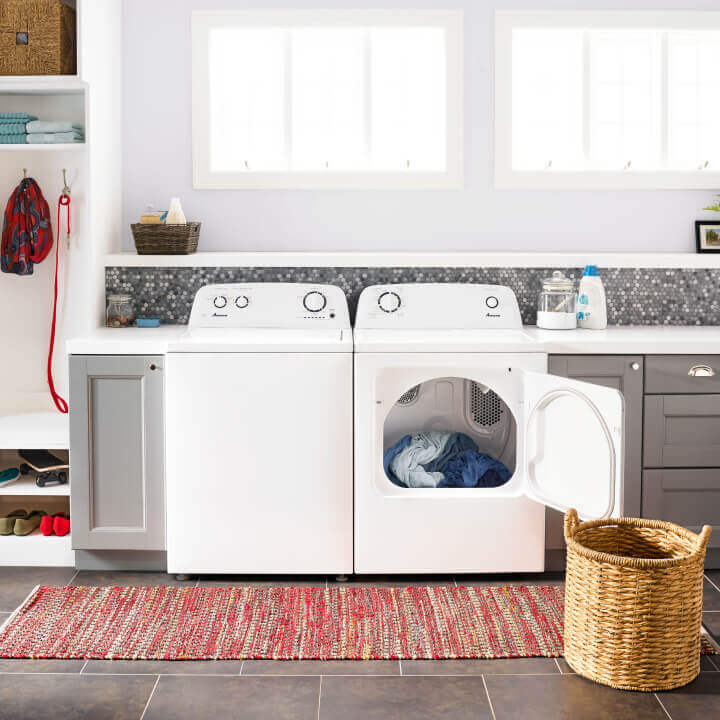 Amana® washer and dryer pair with dryer door open